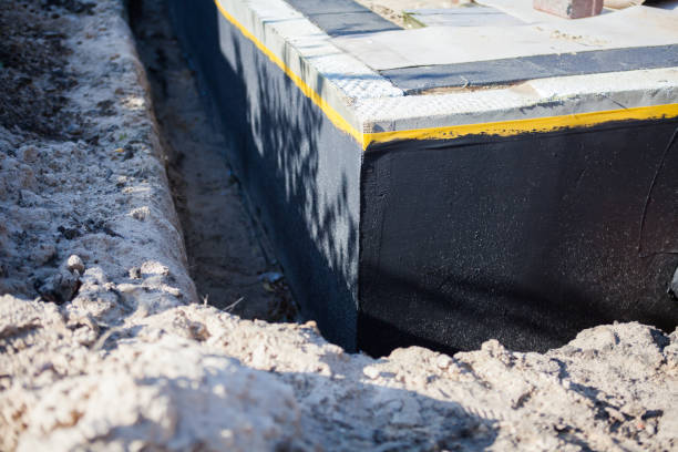 Professional Waterproofing technician working in Versailles, PA